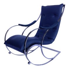 a blue chair sitting on top of a white floor next to a metal frame and foot rest