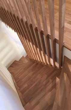 an overhead view of a wooden stair case