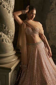 This lehenga set features delicate embroidery in tones of peach and sage green. The blouse has crystal drops at the waist. The four sided embroidered dupatta also has crystal tassels..From Seema Gujral's Inara collection. DELIVERY TIMEPlease allow 8-12 weeks for your outfit to arrive. FABRIC DETAILSNet Professional cleaning only. Sequin Lehenga, Peach Lehenga, Seema Gujral, Sabyasachi Bride, Delicate Embroidery, Lehenga Blouse, Sequin Embroidery, Embroidered Dupatta, Hem Blouse