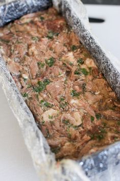 a pan filled with food sitting on top of a table