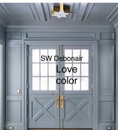 the front door is painted blue and has white trim on it, while the words sw debonair love color are in gold