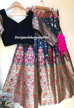 Perfect for Sangeet, engagement and wedding parties. All size available from XS to 5XL Fabric details- Top- Velvet with matching banarasi sleeves Lehenga- Pure Banarasee(Hand woven) Dupatta- Net with sequins. Navy blue in colour. Can also be made in black and bottle green. Dupatta color can be changed. Cancan attached. Fitted Dola Silk Lehenga With Zari Weaving, Fitted Banarasi Silk Lehenga With Meenakari Detail, Fitted Banarasi Silk Lehenga With Meenakari, Fitted Brocade Lehenga With Meenakari Details, Festival Lehenga With Dupatta In Brocade, Anarkali Style Choli With Zari Weaving For Party, Party Anarkali Choli With Zari Weaving, Fitted Lehenga With Zari Weaving For Festivals, Banarasi Silk Choli With Zari Weaving For Party