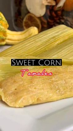 sweet corn tamales on a white plate next to other food items and the words, sweet corn tamales