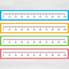 three rulers with different colors and numbers on them, one has a ruler in the middle