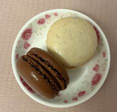 two pastries are sitting on a floral plate