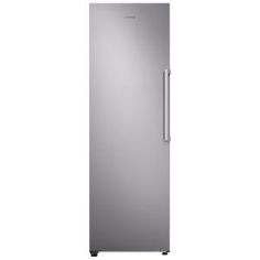 a silver refrigerator freezer sitting on top of a white wall