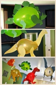 some balloons are hanging in the shape of dinosaurs