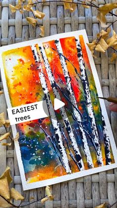 an art card with the words easyest trees printed on it and some autumn leaves