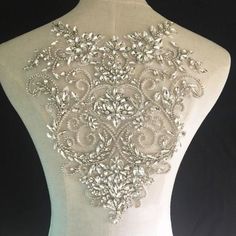 * * * * * * N o t e * * * * * *If you choose express shipping, contact number is a MUST for shipping, please leave it with orders, Thank you.* * * Welcome to our shop, enjoy your shopping moment!Silver Crystal Appliques Rhinestone Wedding Dresses Embellished Bling Addition for Bodices Party Dress Costumes* * * * * * S i z e * * * * * *30 x 26 cm(12" x 10.2")* * * * * C o l o r * * * * * Silver* * * * Ｑ u a n t i t y * * * *This listing is for 1 piece, more in store.MORE RHINESTONE APPLIQUE: http Silver Bedazzled Wedding Dress, Silver Rhinestone Wedding Dresses, Fitted Wedding Dress With Rhinestones, Rhinestone Wedding Dresses, Rhinestone Wedding Dress, Bodice Applique, Wedding Sash Belt, Bead Sewing, Embroidered Lace Fabric