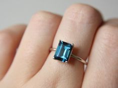 S8 this is my favorite Etsy listing at https://www.etsy.com/listing/660560089/london-blue-topaz-ring-london-blue-topaz Blue Emerald Cut Solitaire Topaz Ring, London Blue Topaz Engagement Ring, November Birthstone Ring, Blue Topaz Engagement Ring, Topaz Engagement Ring, London Blue Topaz Ring, November Birthstone, London Blue Topaz, Blue Topaz Ring