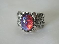 Dragons Breath Fire Opal Triple Moon Ring wiccan jewelry pagan | Etsy Fantasy Style Silver Metal Rings, Fantasy Style Silver Rings Made Of Metal, Magical Silver Jewelry With Sun And Moon Design, Magical Silver Moon Phase Jewelry, Magical Silver Moon Jewelry, Gothic Silver Oval Jewelry, Silver Gothic Oval Jewelry, Magical Sun And Moon Design Ring, Mystical Sun And Moon Design Ring