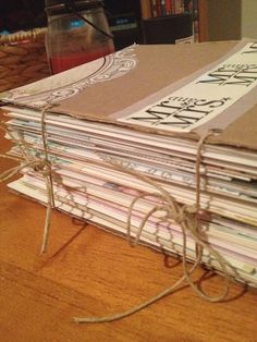 a stack of books sitting on top of a wooden table