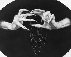 a black and white drawing of two hands holding a rose