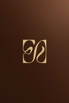 the letter s is inscribed in gold on a brown background