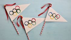 two olympic themed paper kites with candy canes