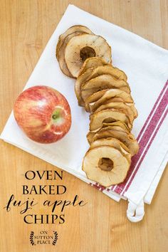 an apple and some sliced apples on a napkin