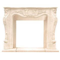 a white marble fireplace mantel with an ornate design