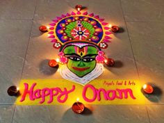 a sign that says happy onam with lights around it and an image of a woman's face