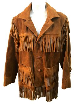 Great condition classic 60's suede western fringe jacket. Leather buttons. No stains. Two front pockets with fringe. Fringe hem.,  Buckskin leather of this age is tough- with continued use will loosen up. That said the jacket is totally wearable but sold AS IS. Marked size 36. Can be unisex. Please see measurements for proper fit as all sales are final. measurements shoulders measured from shoulder seam on top to shoulder seam-17 underarm to underarm  21 sleeves 24 length from top of shoulder to Western Style Winter Outerwear With Snap Buttons, Western Leather Outerwear With Button Closure, Western Style Leather Outerwear With Button Closure, Western Style Outerwear With Buttons For Fall, Western Style Fall Outerwear With Snap Buttons, Western Style Outerwear With Snap Buttons For Fall, Luxury Brown Leather Jacket With Snap Buttons, Luxury Brown Leather Jacket With Buttons, Designer Brown Blazer With Buttons