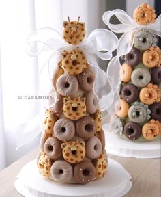 two cakes made to look like donuts are stacked on top of each other