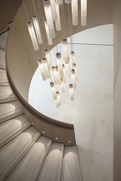 a spiral staircase with many lights hanging from it