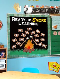 a classroom with a bulletin board that says ready for smore learning on the wall