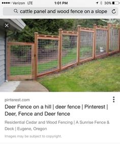 the fence is made out of wood and wire