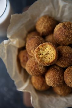 a bunch of doughnuts sitting in a paper bag