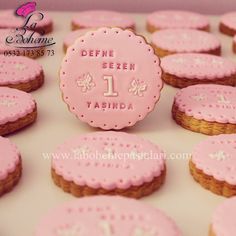 there are some cookies that have been decorated with pink icing