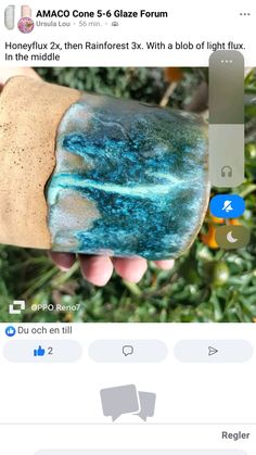 someone is holding something in their hand and it looks like they have been dyed blue