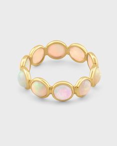 This handcrafted ring showcases a delicate circle of luminous opals set in 14k gold, handmade with care in NYC. Each opal stone exhibits subtle variations in color, creating a shimmering, iridescent effect that captures the beauty of natural opals. The elegant design offers a modern take on classic opal jewelry, perfect for everyday wear or special occasions. Opal 14 Karat Gold Size 5,6,7,8,9 Handmade in NYC Precious Opal, Bezel Ring, Citrine Crystal, Handcrafted Rings, Opal Stone, Natural Opal, Opal Jewelry, Amethyst Crystal, Smoky Quartz