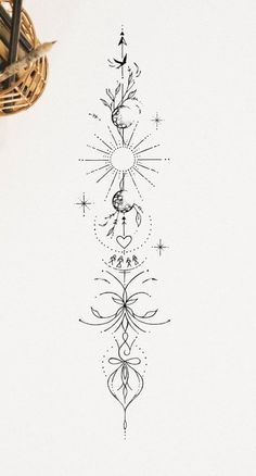 a drawing of an ornate design in black ink on white paper next to a pen