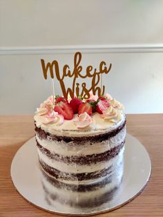 a cake that is sitting on top of a plate with the words make it wish