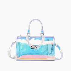 The Iced Out hologram Satchel Bag is back with upgraded materials and a new summer favorite colorway option! This large satchel tote is the perfect beach bag, everyday bag decorated in a translucent shimmer body. Comes with a belted adjustable strap for crossbody use, as well as an inner attachment clutch pouch. Composition: Transparent PU Dimensions: 12 3/8"W x 7 3/4"H x 6 7/8"D 7" Top handle drop 23" Adjustable/detachable long strap Zipper closure Inner removable makeup pouch 12.91 oz Style# T Holographic Purse, Perfect Beach Bag, Holographic Bag, Clear Tote Bags, Hobo Tote Bag, Everyday Tote Bag, Pink Handbags, Clutch Pouch, Satchel Tote