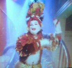 a person dressed as a clown on a television screen