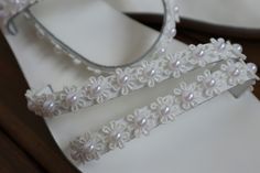 Each bridal sandal is made of genuine Greek leather to order for you. We personalize the sandal by hand, which we decorate with beautiful small daisy lace flowers and pearls. They are ideal to wear at your reception, so you can dance all night comfortably and do not forget to pack them to get your honeymoon. All Pelino shoes are made to ensure the highest level of comfort throughout the day. Full sizes only ** If you have half the size, go UP to the nearest full size This model has narrow straps Handmade Sandals For Spring Wedding, Handmade Wedding Sandals For Spring, Elegant Handmade White Barefoot Sandals, Elegant White Handmade Barefoot Sandals, Elegant Handmade Barefoot Sandals With Open Toe, Handmade Adjustable Sandals For Wedding, Handmade White Sandals For Wedding, White Pearl Embellished Wedding Shoes For Summer, Handmade White Wedding Sandals