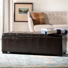 a living room with a couch, chair and ottoman