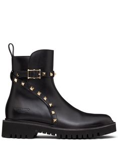 Black Tie Collection black calf leather pull-tab at the heel decorative buckle detail gold-tone Rockstud embellishment round toe chunky rubber sole Tie Collection, Valentino Rockstud, Leather Pulls, Shoes Booties, Lug Sole, Dolce & Gabbana, Black Ankle Boots, Leather Ankle Boots, Boot Shoes Women