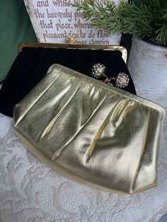 You get both purses with this listing! The gold lame purse or clutch is much older - 50s or 60s.... And was most likely never used. It still has its original matching coin purse.... The black one is from the 80s.  Both have carting straps that can fold out and be used. Classic Evening Coin Purse Clutch, Classic Evening Clutch Coin Purse, Chic Gold Bags For Vintage Events, Vintage Gold Coin Purse For Party, Vintage Gold Coin Purse For Formal Occasions, Retro Gold Evening Bag For Parties, Gold Retro Evening Bag For Parties, Classic Gold Clutch For Events, Gold Clutch Evening Bag For Cocktail