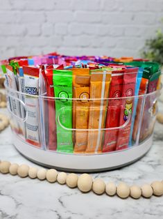 a plastic container filled with lots of different types of candy