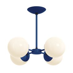 three white balls are hanging from a blue metal fixture on a white background with an orange light bulb in the center