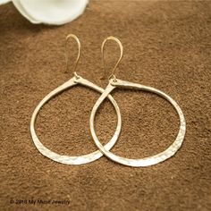 "These lovely gold fill hoop earrings are beautiful and lightweight. They have been hammered to give a nice texture which catches the light. These everyday earrings are for those who love the look of gold without the big price tag. I have used 14/20k gold fill wire for both the earwires and the hoop. They are hammered into a nice teardrop shape. These are made to order. They measure 2\" with the gold fill earwire and the hoop by itself measures approximately 1 1/2\" long. They measure 1 3/8\" at Big Gold Hoop Earrings, Hoop Earrings Big, Teardrop Hoop Earrings, Hoops Gold, Earrings Big, Dangle Hoop Earrings, Bronze Jewelry, Gold Filled Hoops, Hoop Earrings Gold