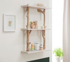 the shelves are made out of branches and have decorations on them, along with other items