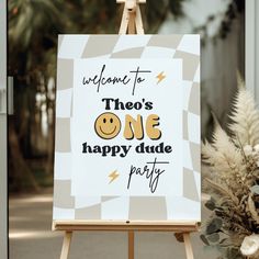 an easel with a sign that says welcome to those one happy dude party on it