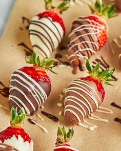 chocolate covered strawberries are arranged on a table