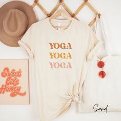 Yoga Yoga Yoga Shirt, Yoga Shirt, Yoga Gift, Yoga Gift for Her, Yoga Lover Gift, Meditation Shirt, Namaste Shirt Hi there! Welcome to Ruby Rae Tees, I'm so happy you stopped by! At Ruby Rae Tees, I offer high quality sweatshirts, long sleeves, t-shirts, youth t-shirts, toddler t-shirts, and infant onesies. All of my shirts are designed and printed in the USA. Please continue reading to find out more important information before ordering.  HOW TO ORDER .... 1. Review all product photos 2. Choose size and color. All of our items are unisex, so I recommend sizing up for an oversized look and down for a fitted look.  3. Please click add to cart. You will need to repeat the process for each item that you'd like to order.  4. Then proceed to checkout and your items will ship in 1-3 days. You can Sporty Cotton T-shirt For Light Exercise, Cotton Yoga Activewear, Sporty Yoga T-shirt With Letter Print, Moisture-wicking Cotton Tops For Yoga, Cotton Moisture-wicking Yoga Top, Moisture-wicking Cotton Yoga Top, Cotton Activewear With Text Print For Workouts, Comfortable Letter Print Activewear For Workout, Sporty Letter Print T-shirt For Yoga