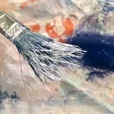 a close up of a brush with some paint on it