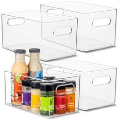 two clear storage bins with lids for spices and condiments, each containing different types of seasonings