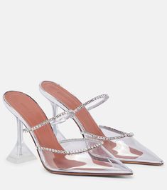 Gilda embellished PVC mules in silver - Amina Muaddi | Mytheresa Pyramid Heels, Muaddi Shoes, Amina Muaddi Heels, Amina Muaddi Shoes, Dr Shoes, Glass Slippers, Crystal Heels, Amina Muaddi, Embellished Sandals