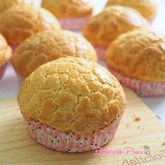 some muffins are sitting on a cutting board